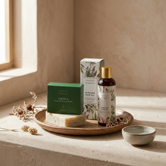 Cosmetic products including a bottle, box, and soap on a wooden tray with a neutral background